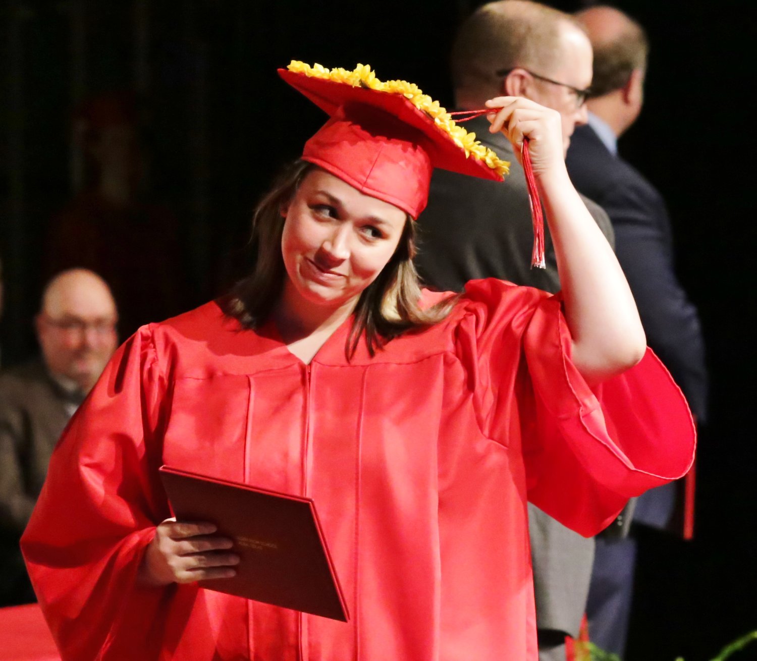 AGHS graduate Breanna Gallimore adjusts her tassel on her customized hat, while casting a glance to the crowd.